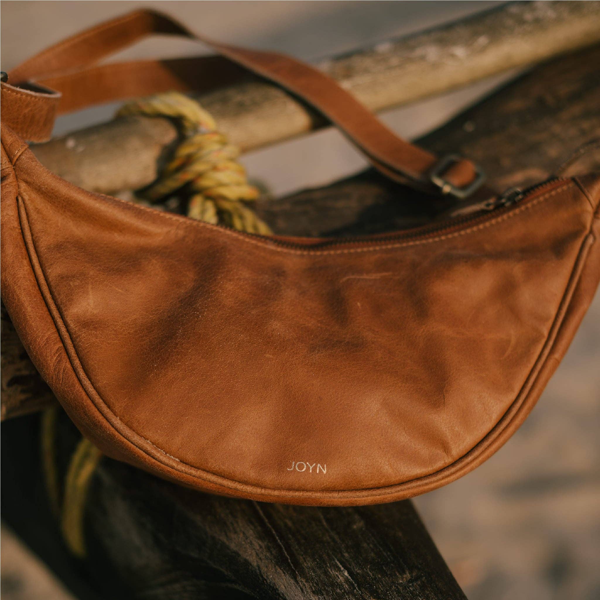 Pebbled Leather Moon Sling Bag - Camel