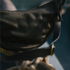 Pebbled Leather Moon Sling Bag - Black