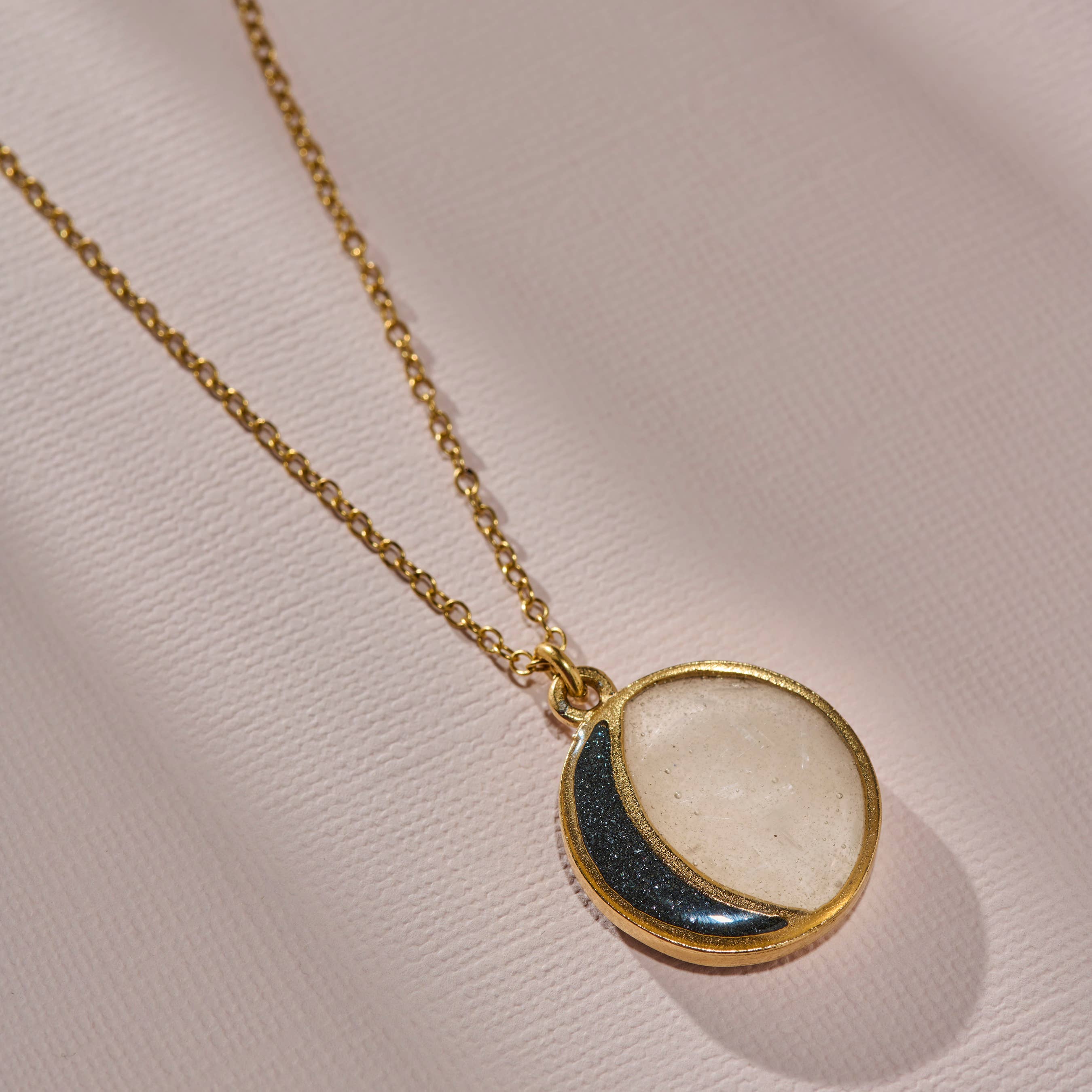 The New Moon Necklace with crushed gemstones