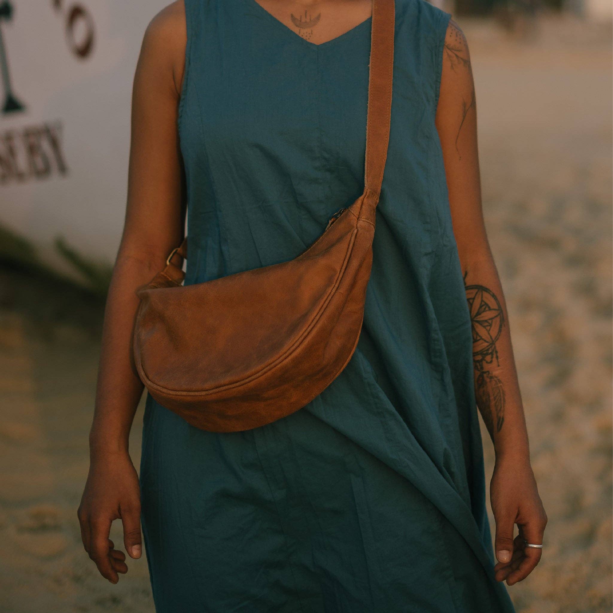 Pebbled Leather Moon Sling Bag - Camel