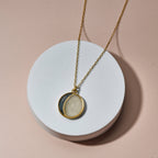 The New Moon Necklace with crushed gemstones